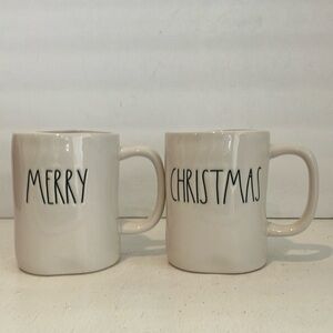 Preowned but like new. A pair of Rae Dunn mugs with Merry and Christmas on them.